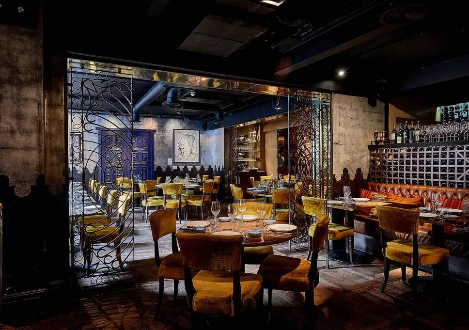 The candlelit dining room at Coya Mayfair
