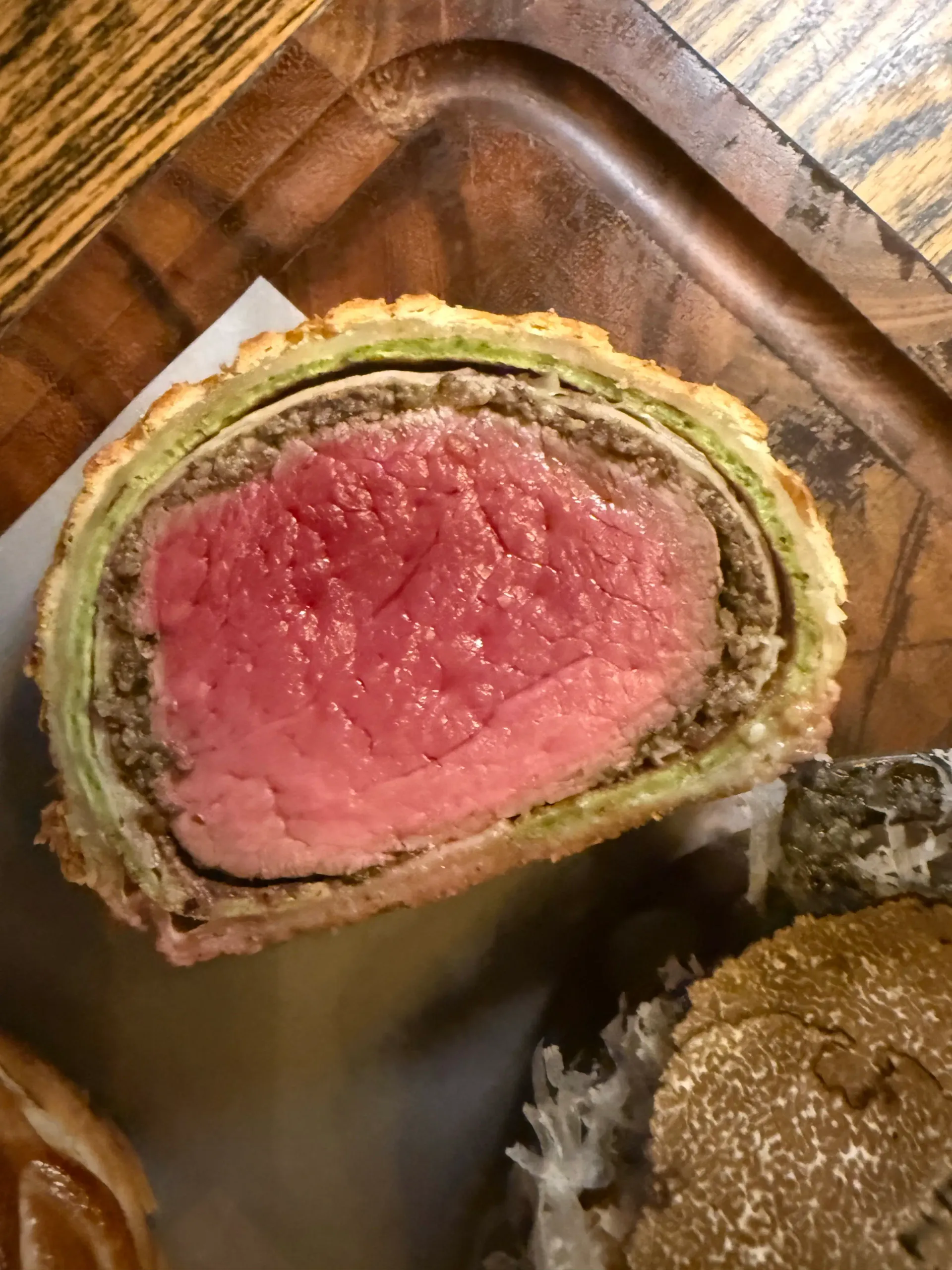 A slice of beef Wellington served pink at The Dog & Pickle in Moreton, Essex